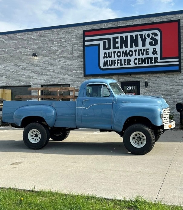Blue vintage truck in front of Denny's Automotive and Muffler Center